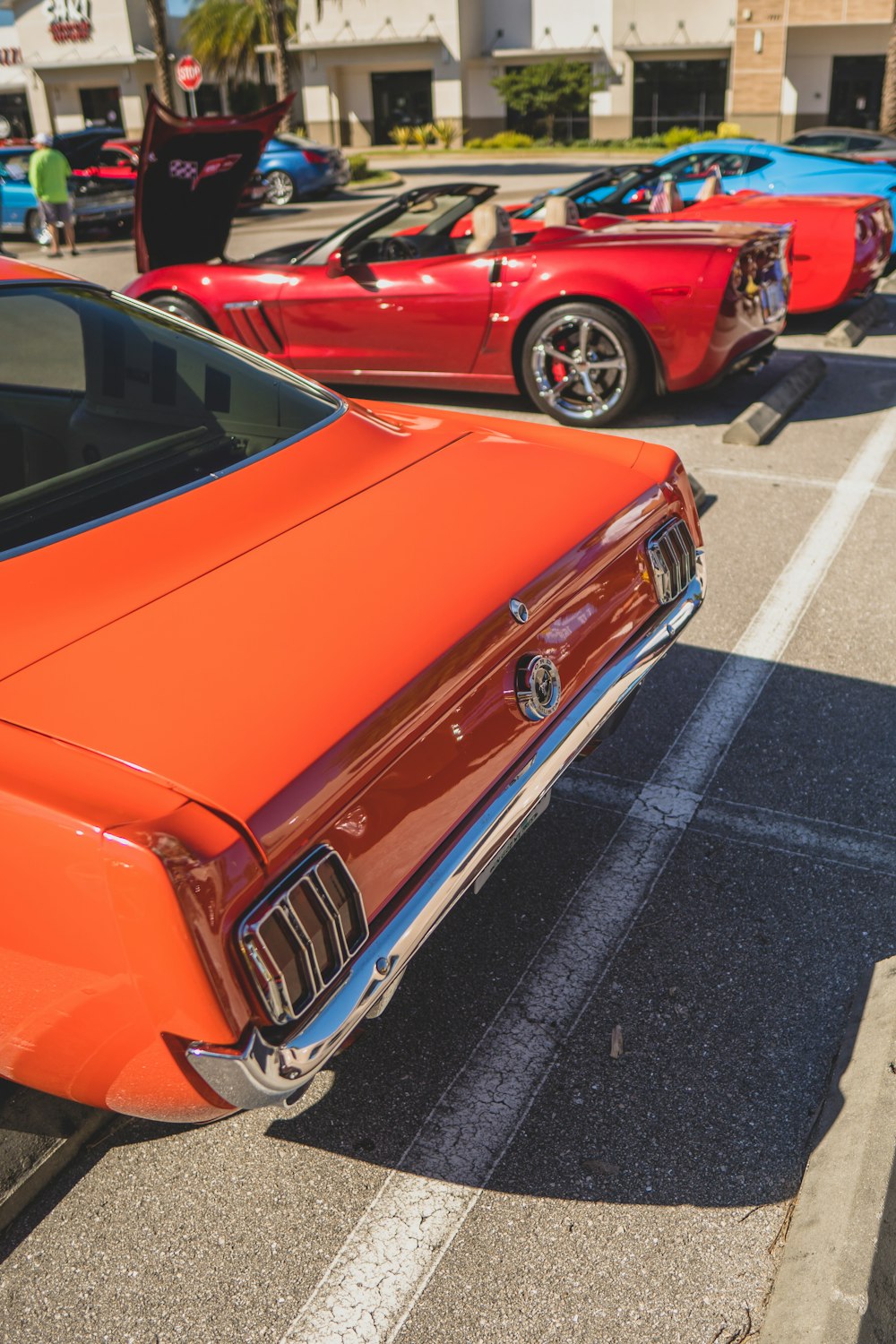 a row of cars parked in a parking lot