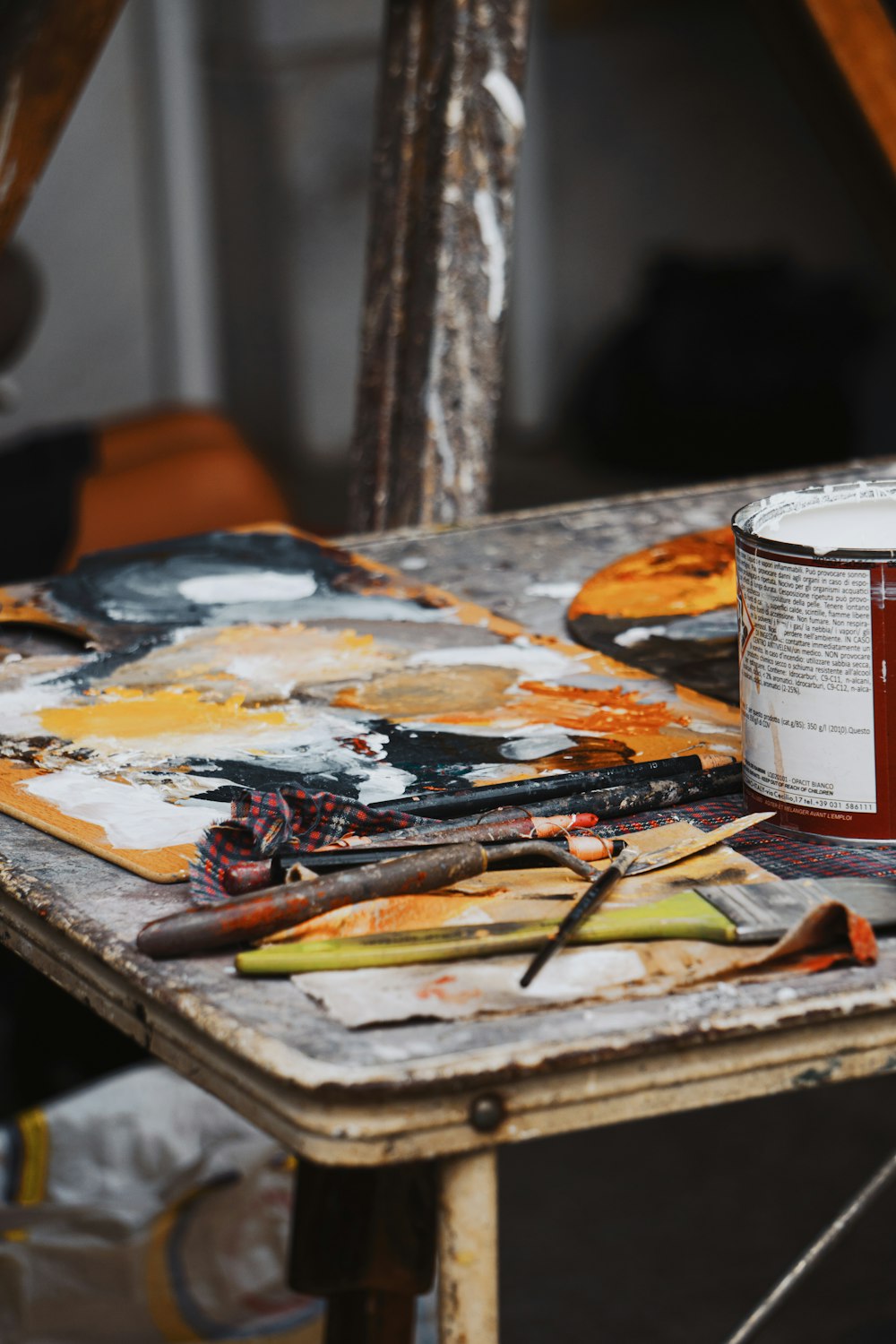 a paint can sitting on top of a wooden table