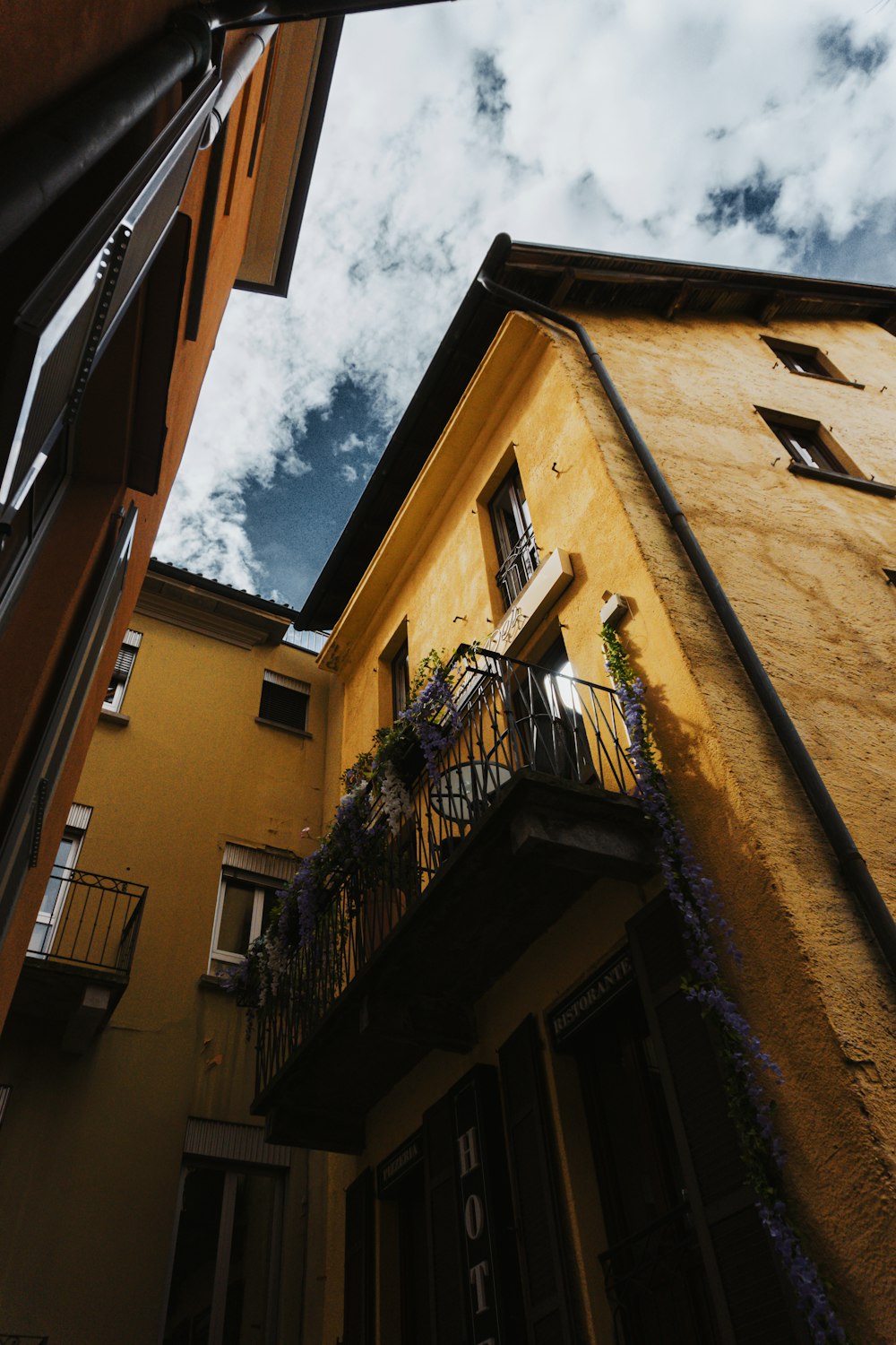 a tall building with a balcony and a balcony