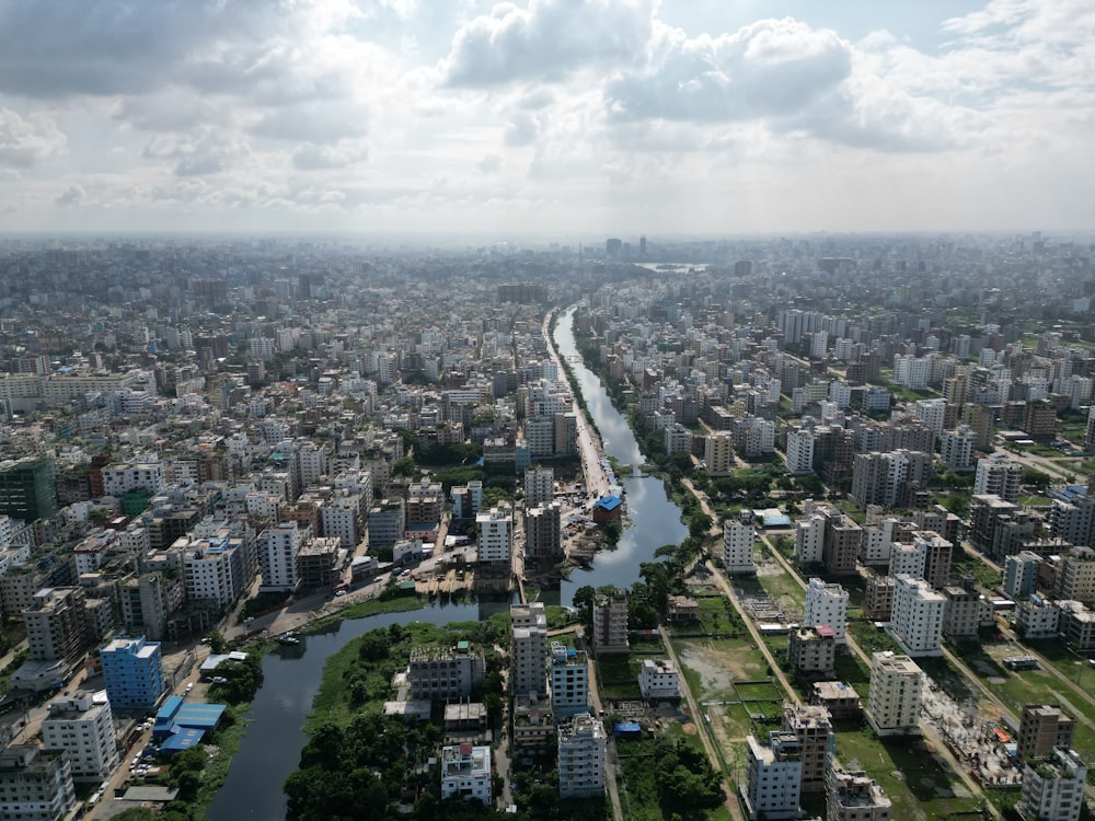 an aerial view of a river running through a city