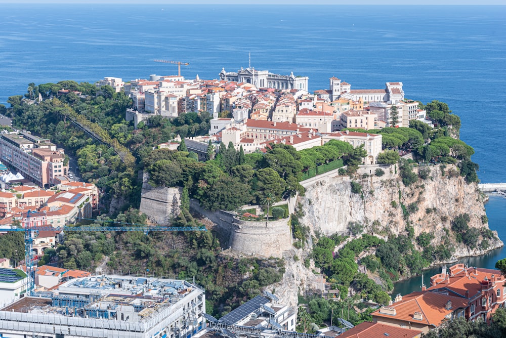 an aerial view of a city on a cliff