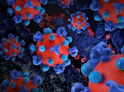 a group of blue and red balls on a black surface