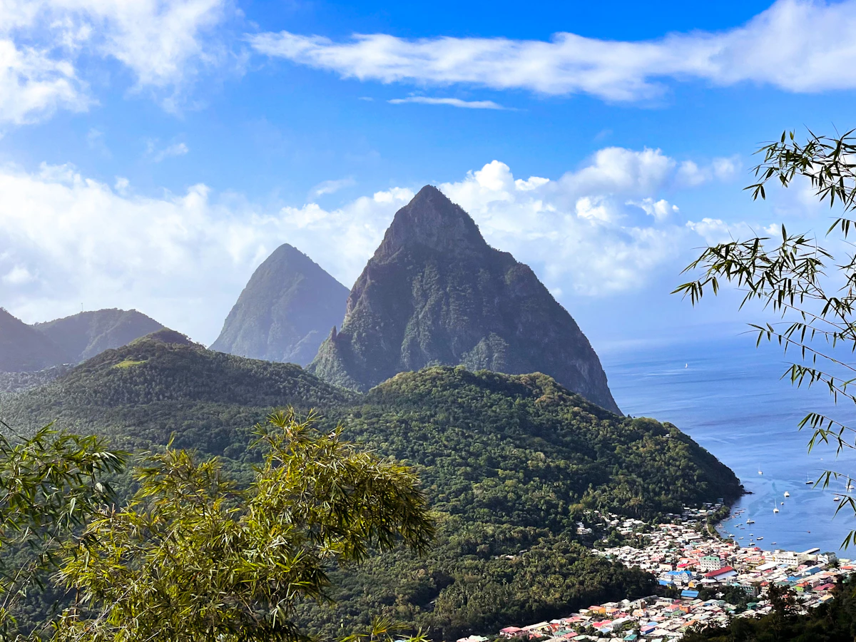A scenic view of the Pitons rising above the sea in St Lucia