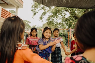 a group of young girls standing next to each other