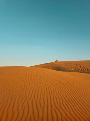 a truck is driving through the desert