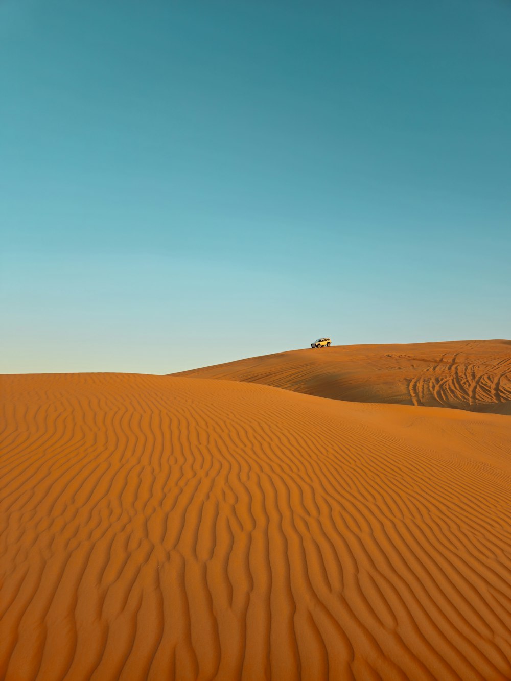 a truck is driving through the desert