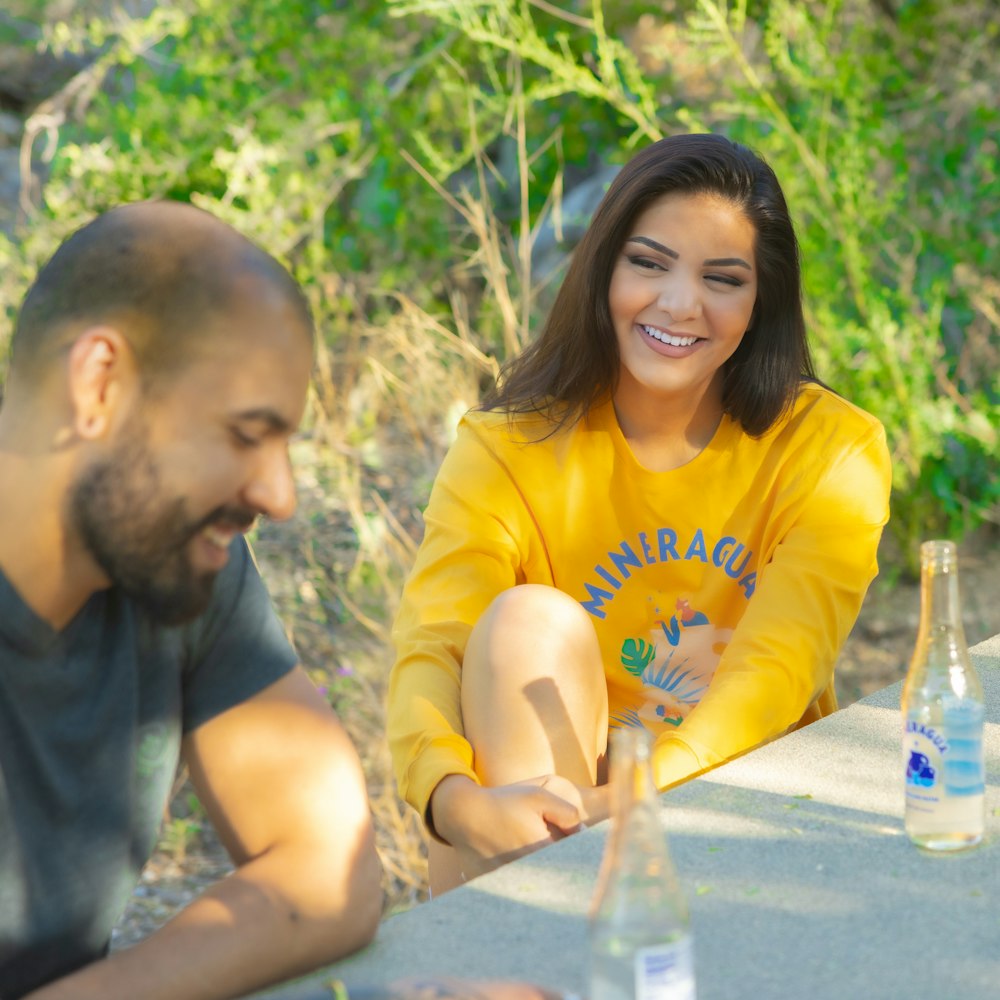 a man and a woman sitting at a table