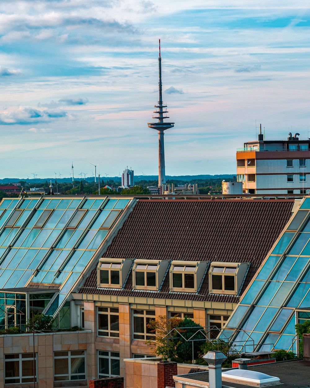 a row of buildings with a tower in the background