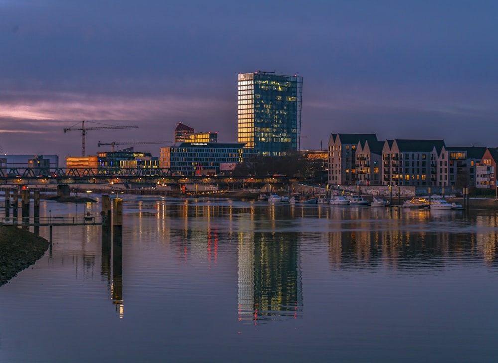 a body of water with a city in the background