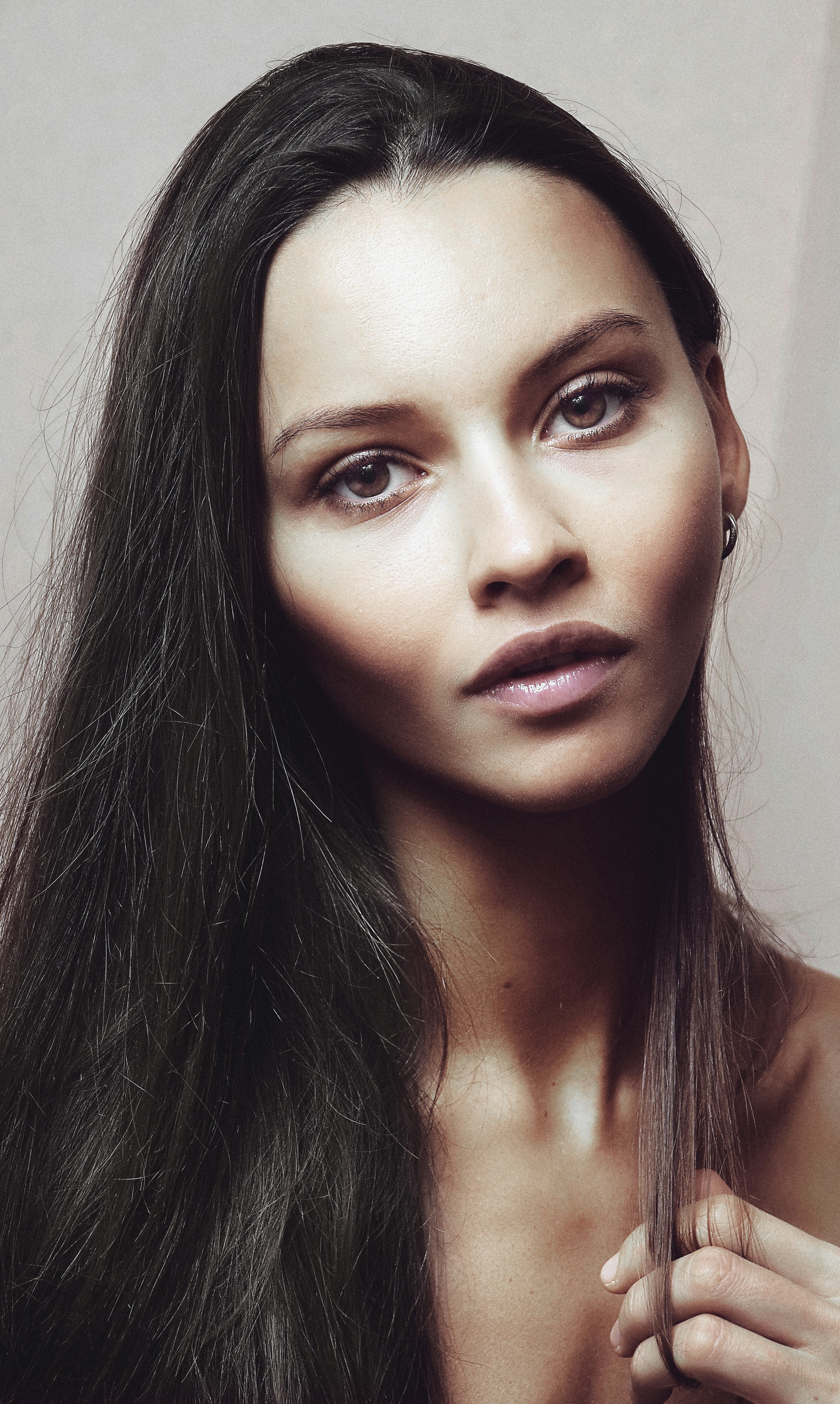 a woman with long hair is posing for a picture