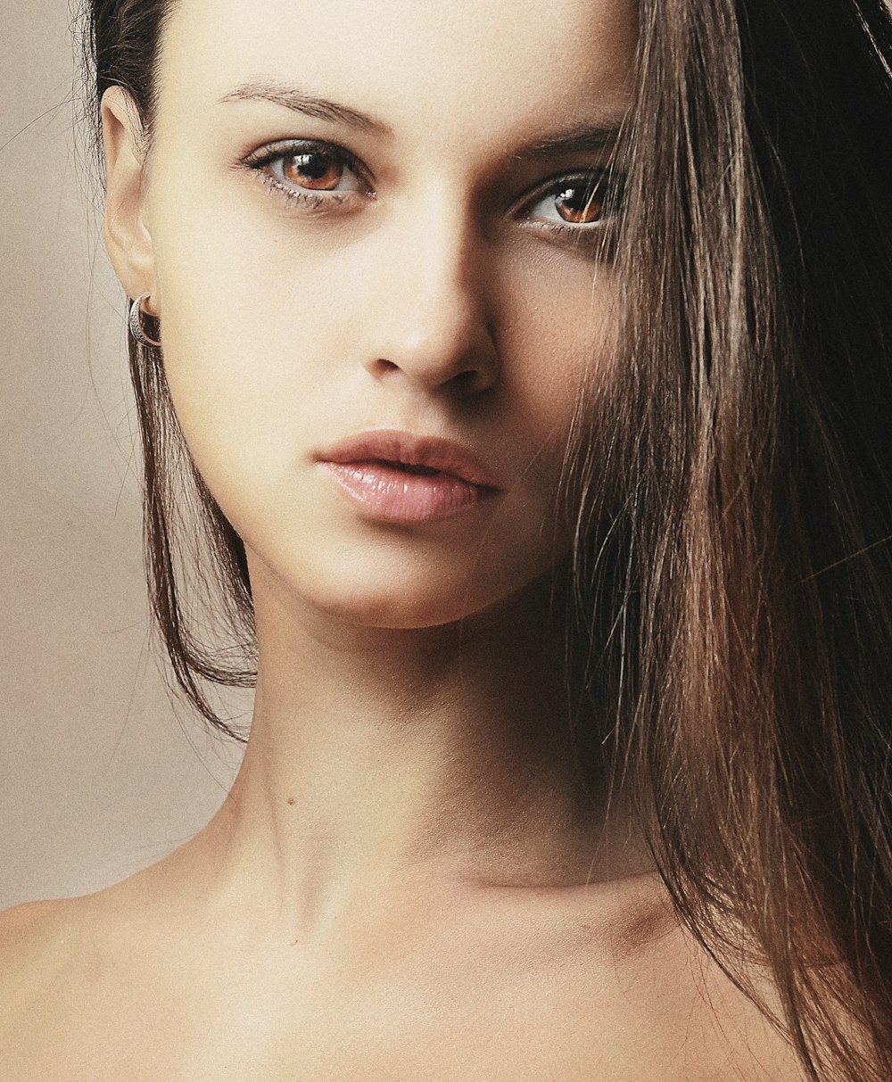 a close up of a woman with long hair