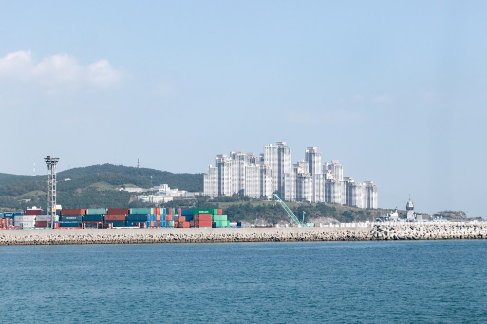 a body of water with a city in the background