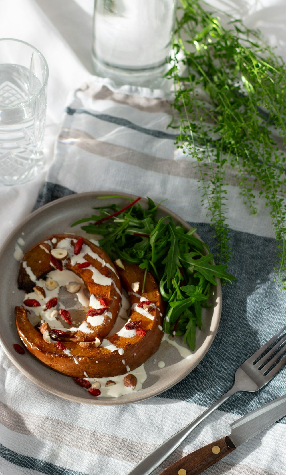 a white plate topped with food next to a fork