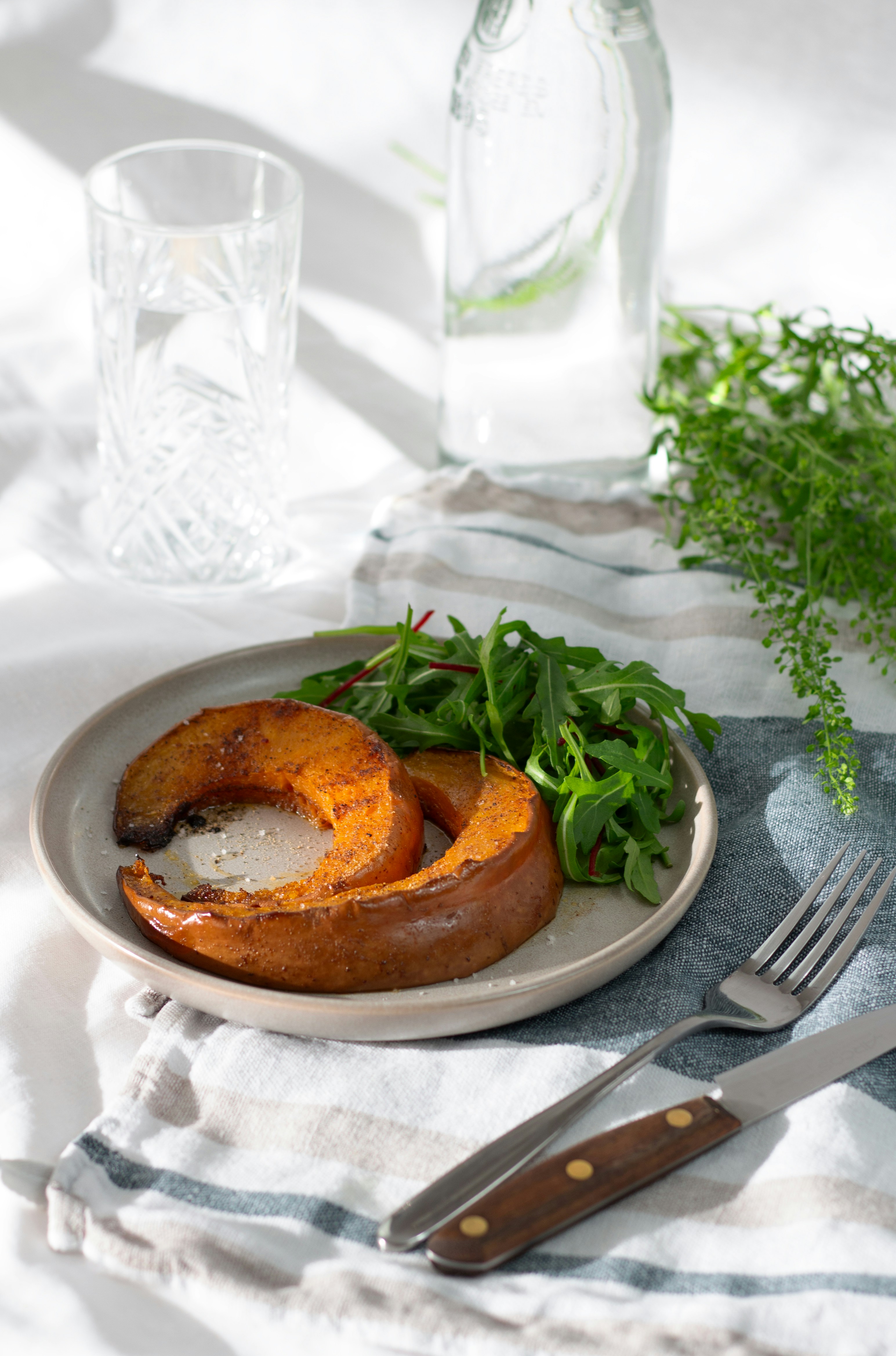 a plate of food on a table with a fork and knife