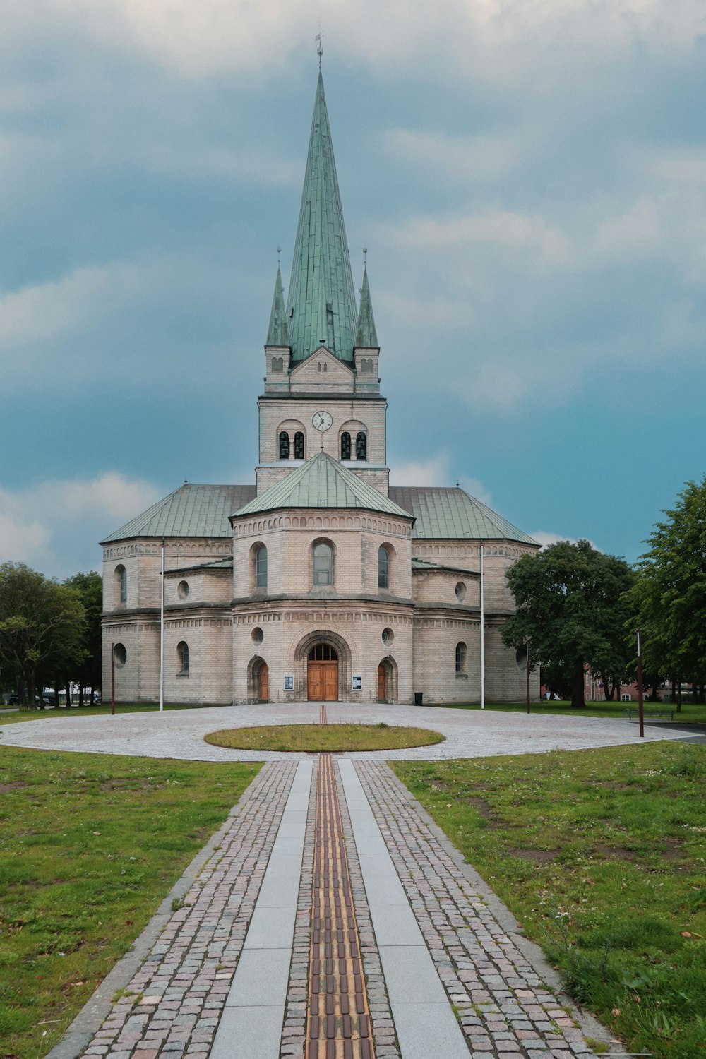 a large church with a steeple and a clock tower