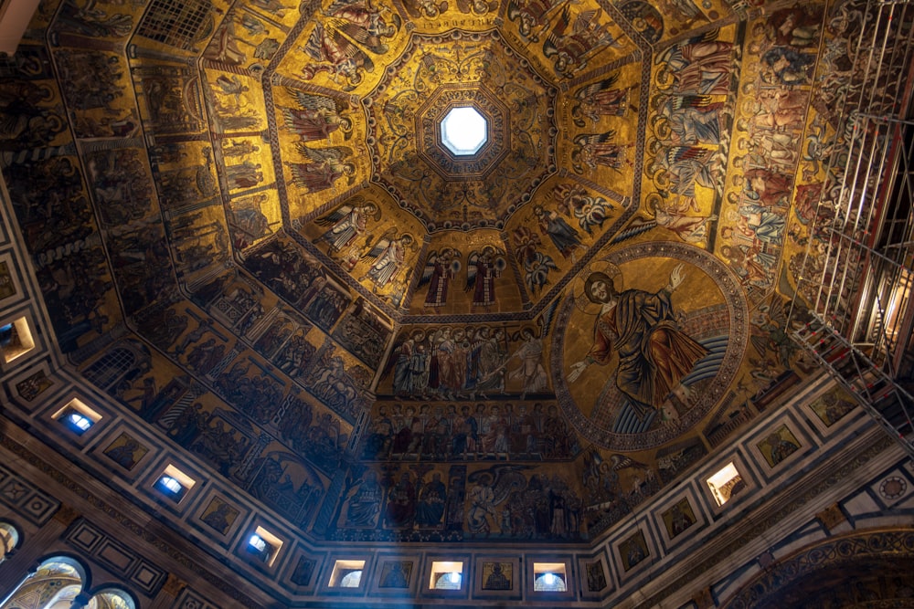 the ceiling of a church with paintings on it