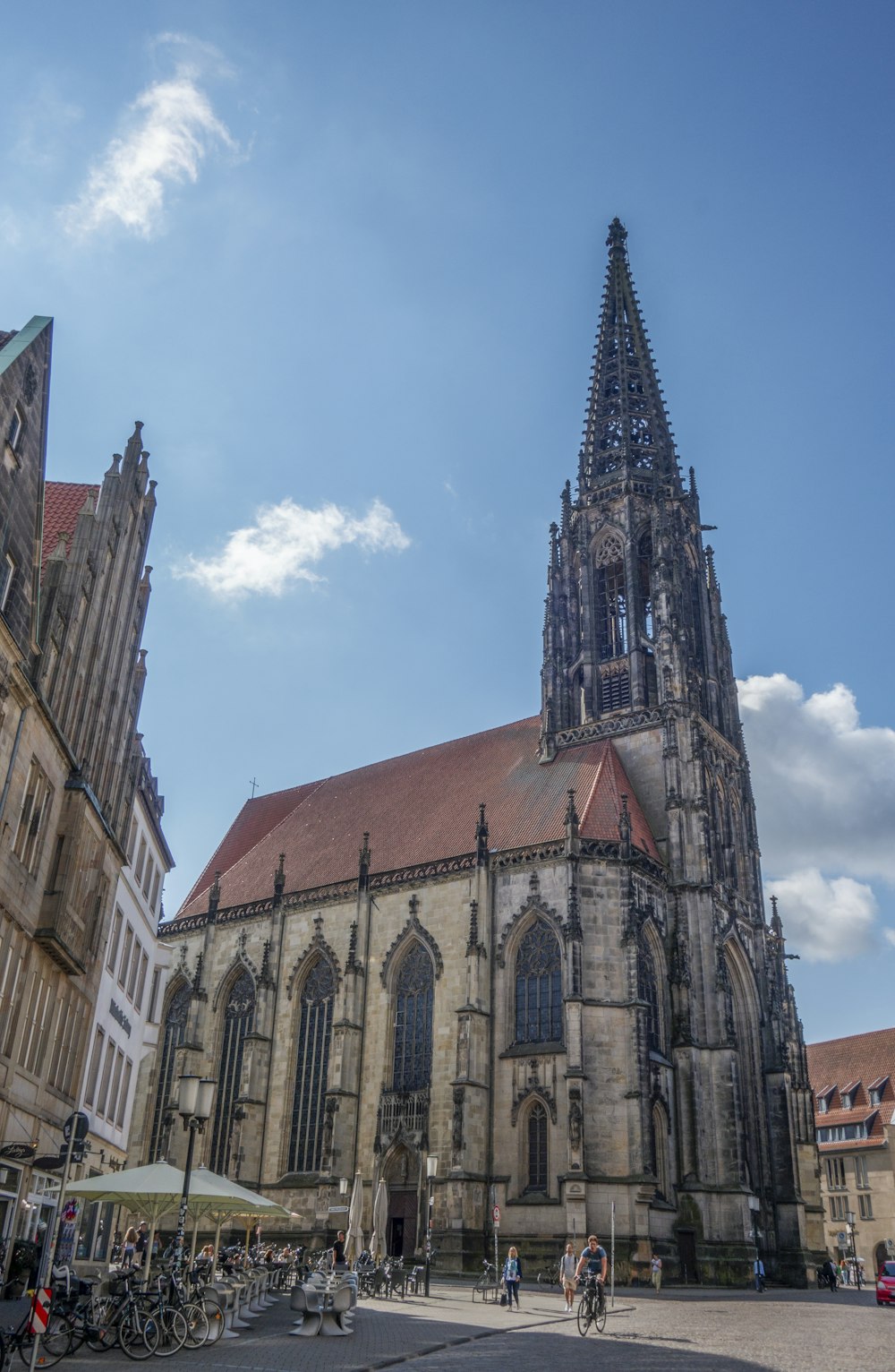 a large church with a tall steeple on a sunny day