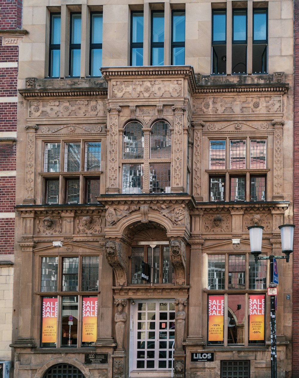 a tall building with a clock on the front of it