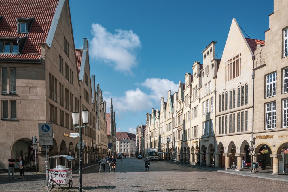 a cobblestone street lined with tall buildings