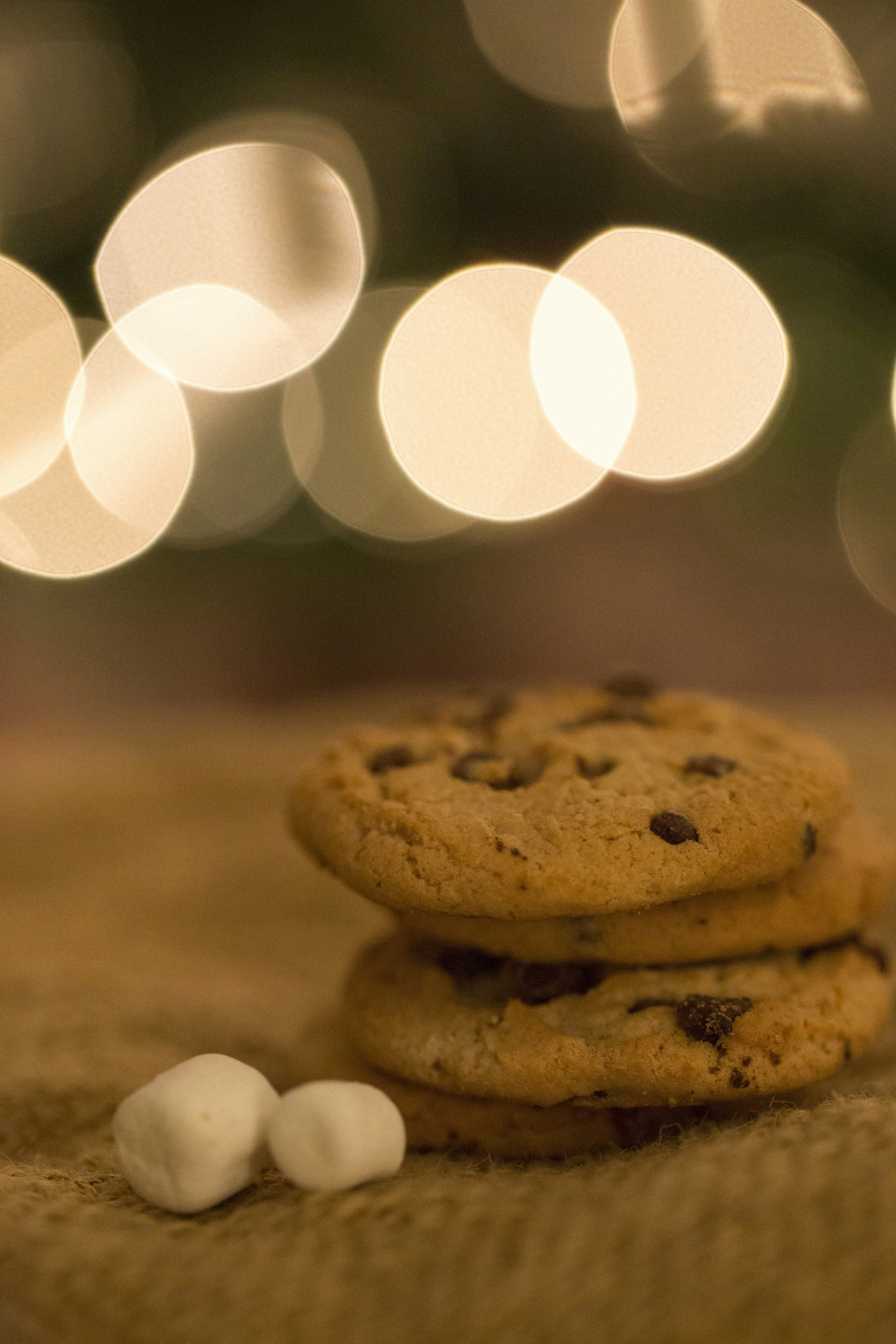 a stack of cookies and marshmallows on a table