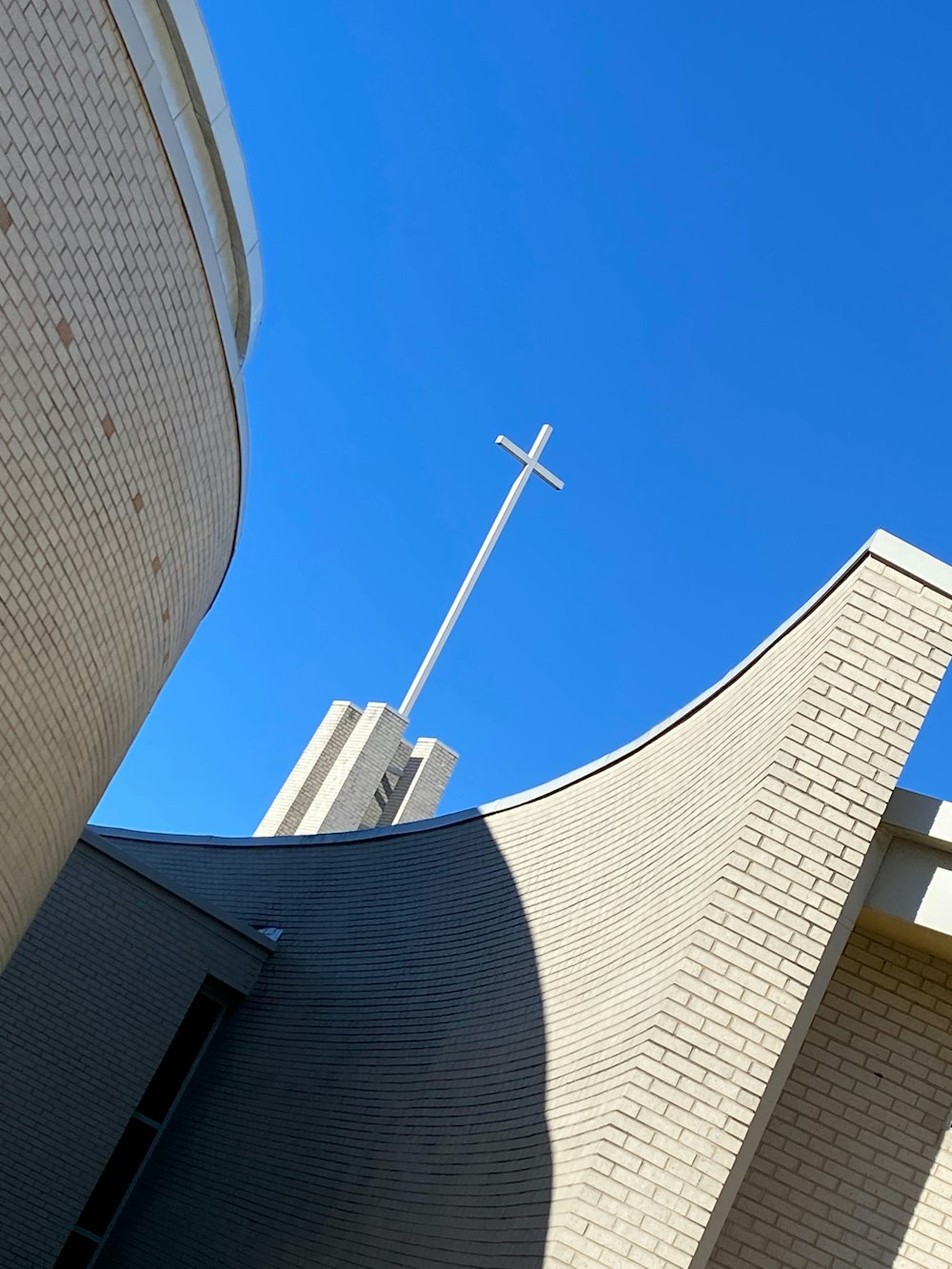 a church steeple with a cross on top of it