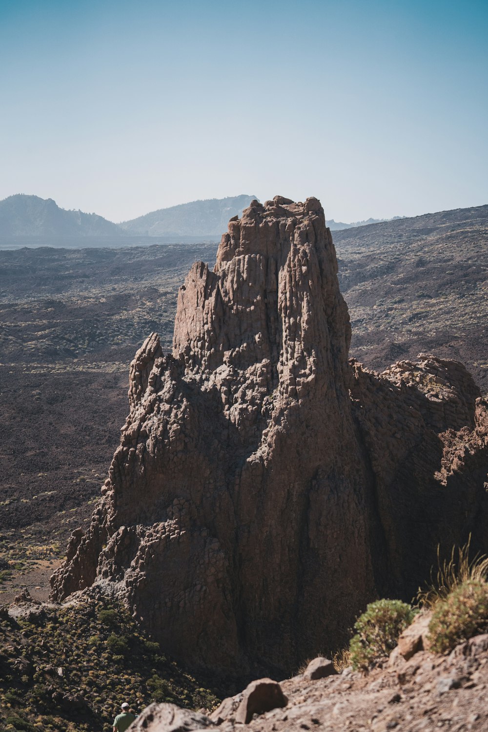 a rocky outcropping in the middle of a desert