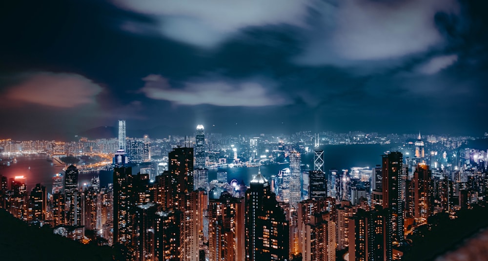 a view of a city at night from the top of a hill