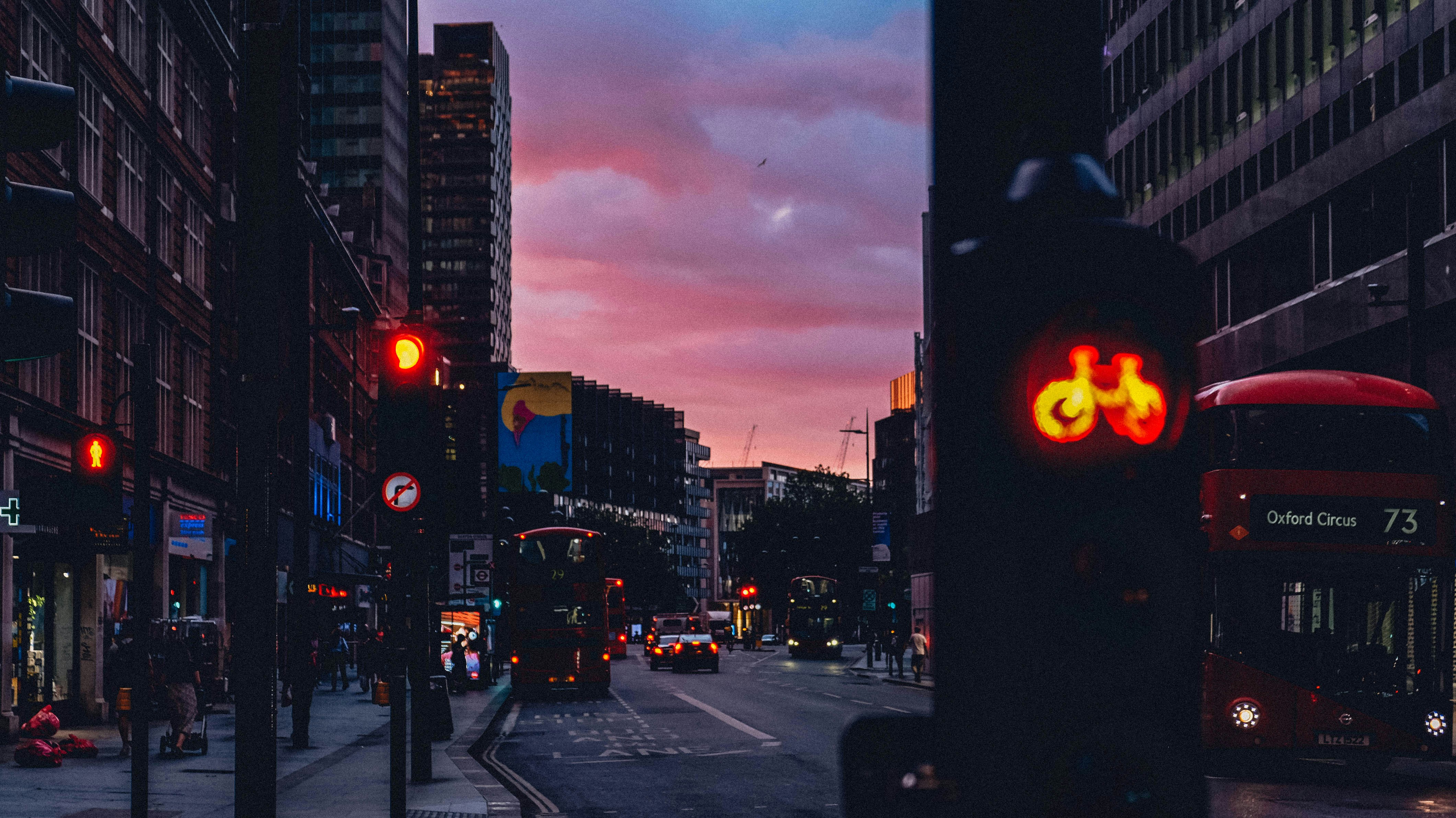a red traffic light sitting on the side of a road