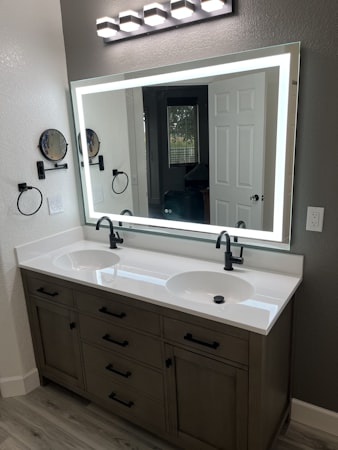 Modern bathroom with LED mirror and double sink vanity