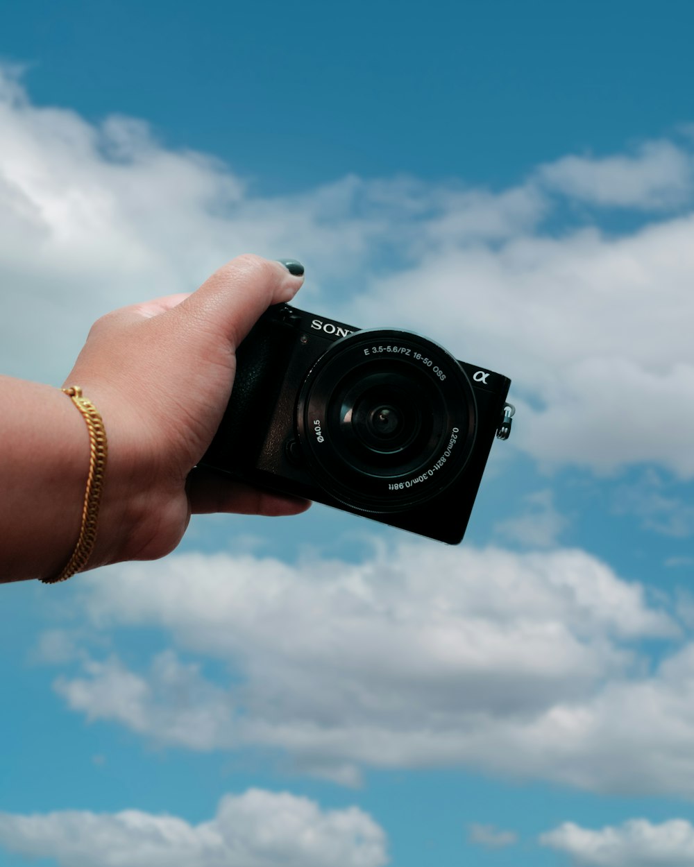 a person holding a camera in their hand