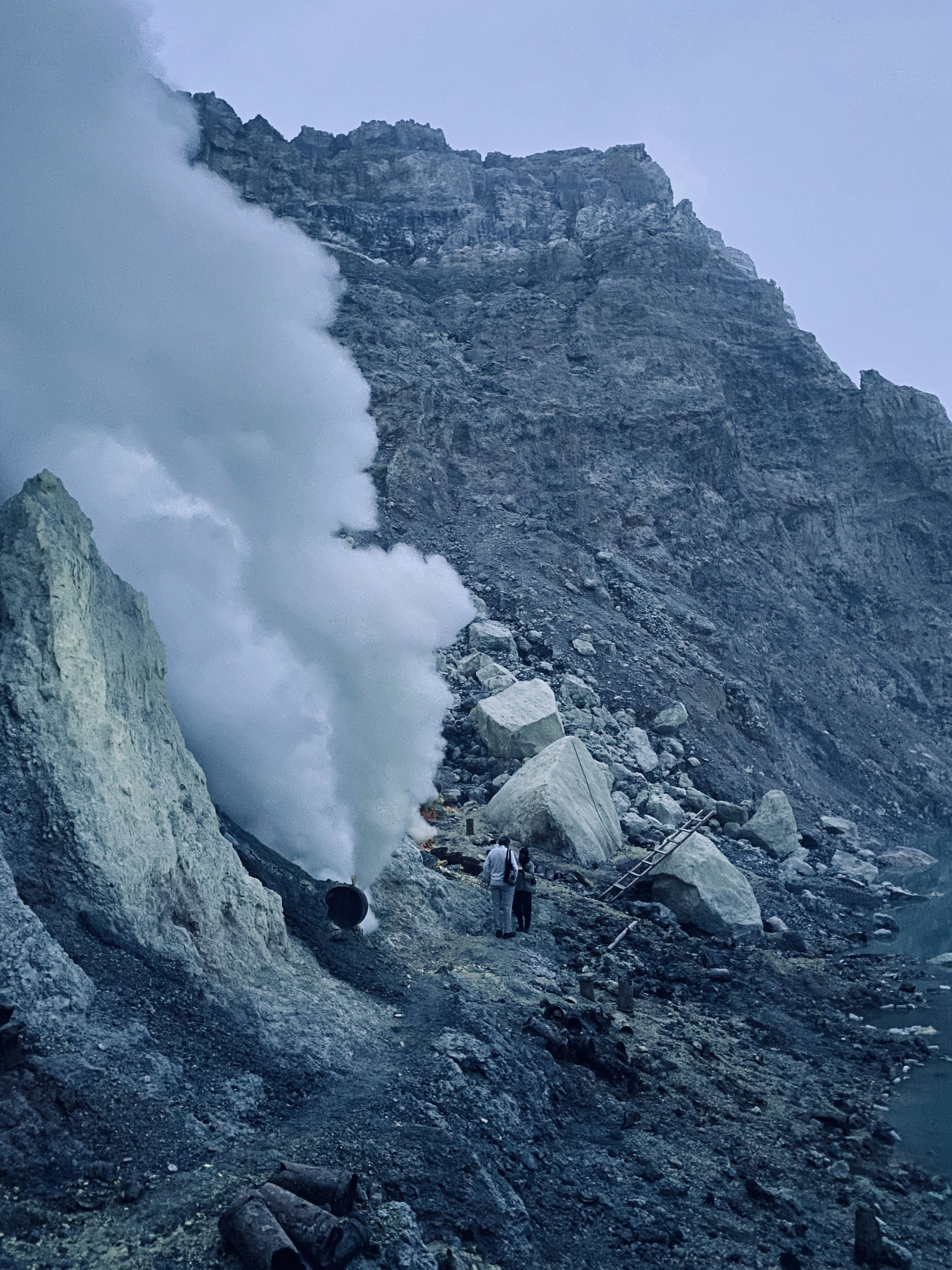 a group of people standing on top of a mountain