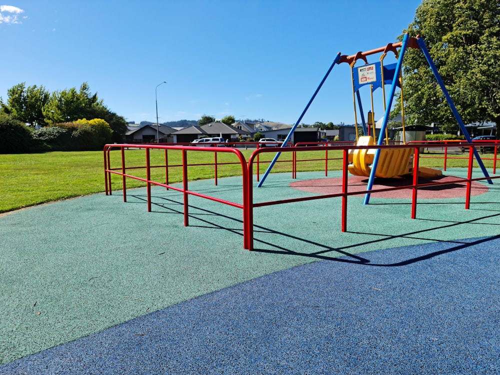 a playground with a swing and a slide