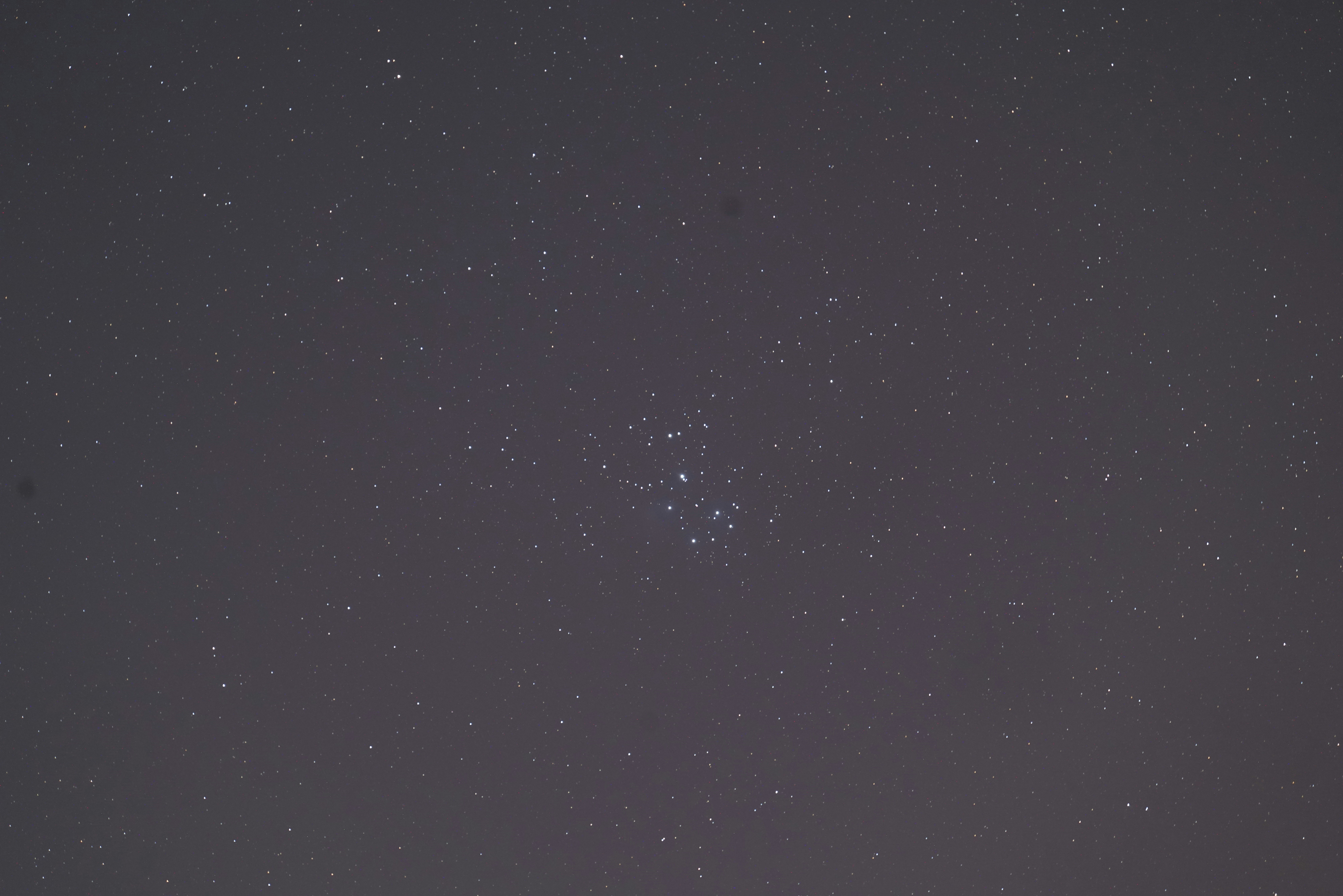 the night sky with a few stars in it