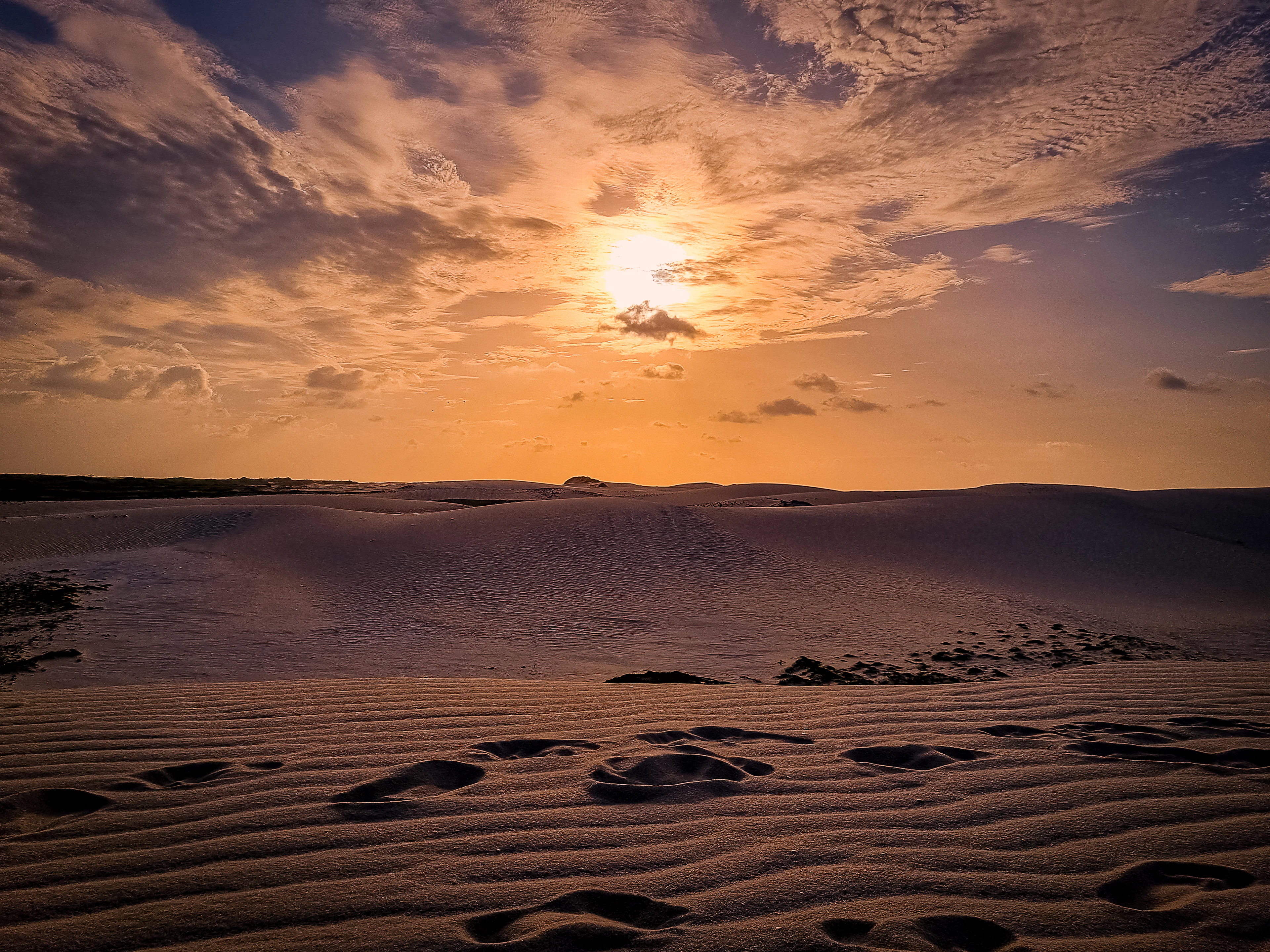 Sunset over wind-rippled dunes at Jericoacoara, Ceará, Brazil