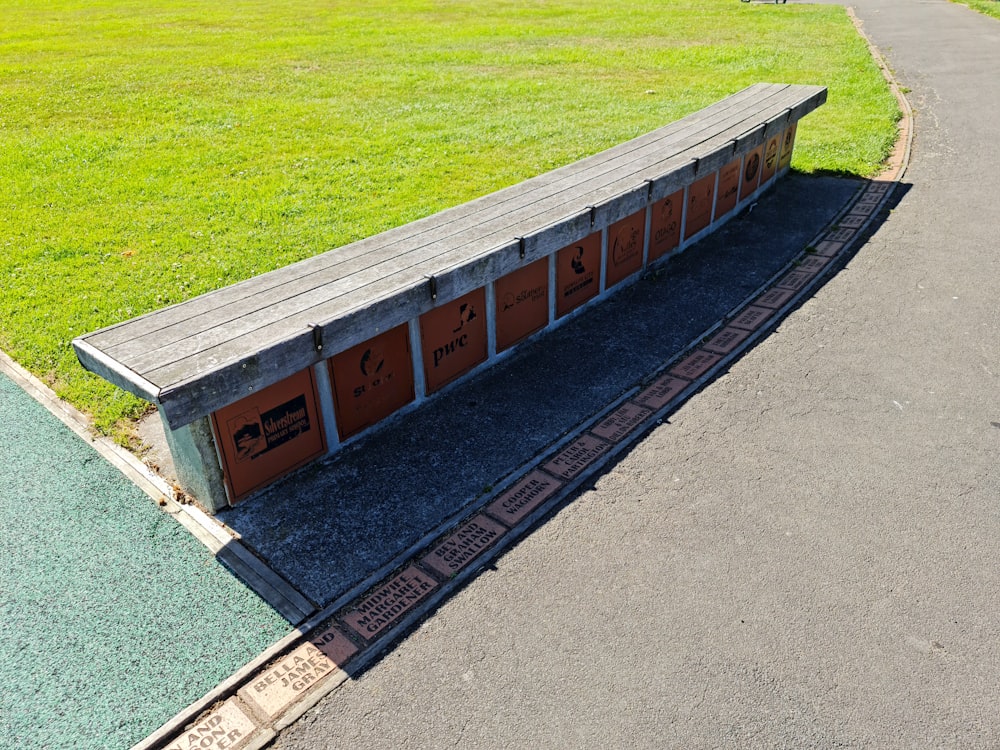 a bench sitting on the side of a road