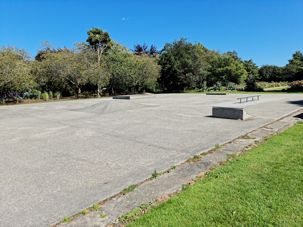 a skateboard park with a few skateboard ramps