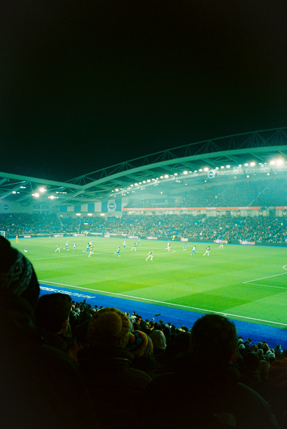 a stadium filled with lots of people watching a soccer game