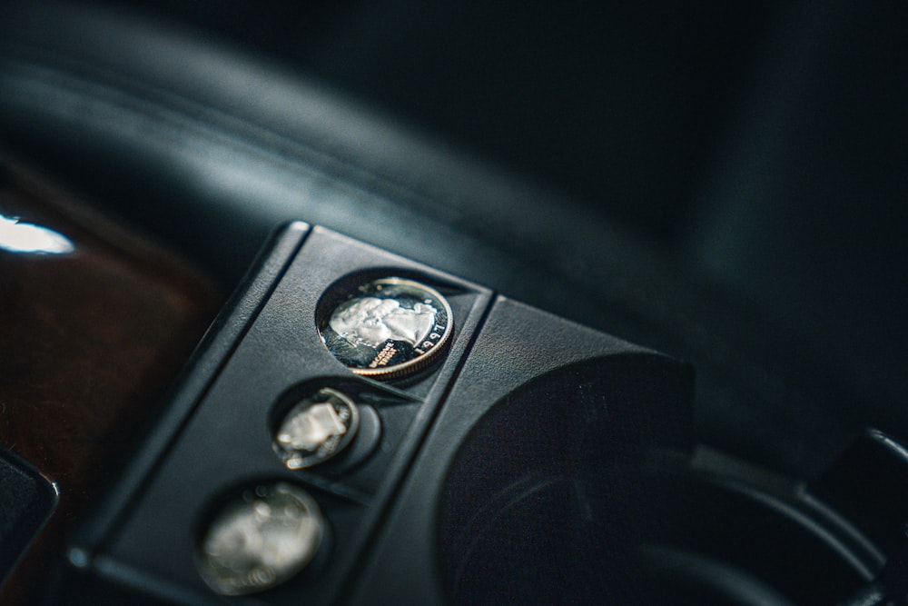 a close up of a car dashboard with buttons