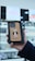 a person holding up a case with a picture of a monkey on it