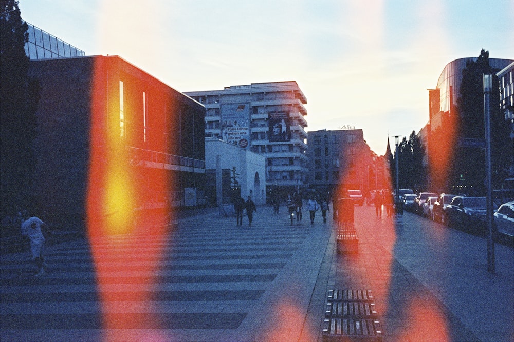 a city street with people walking on the sidewalk