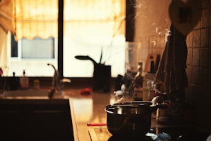 a kitchen with a stove top oven next to a sink
