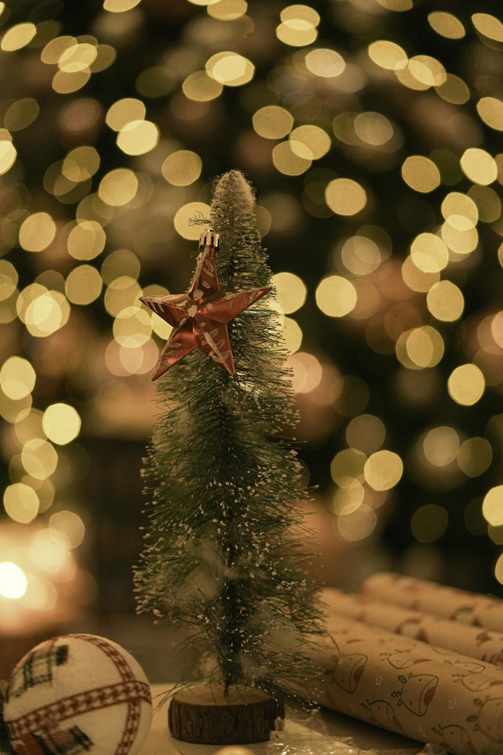 a small christmas tree sitting on top of a table