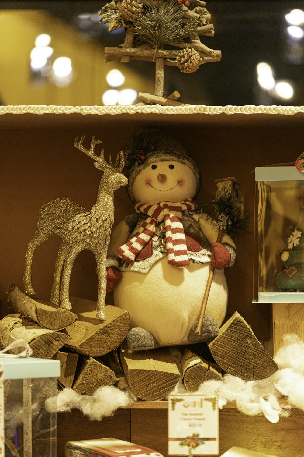 a christmas display in a store with a snowman and reindeer