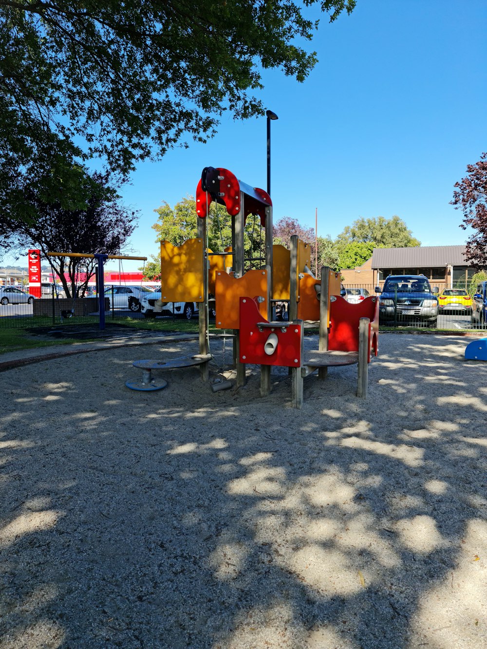 a playground in a park with a play structure