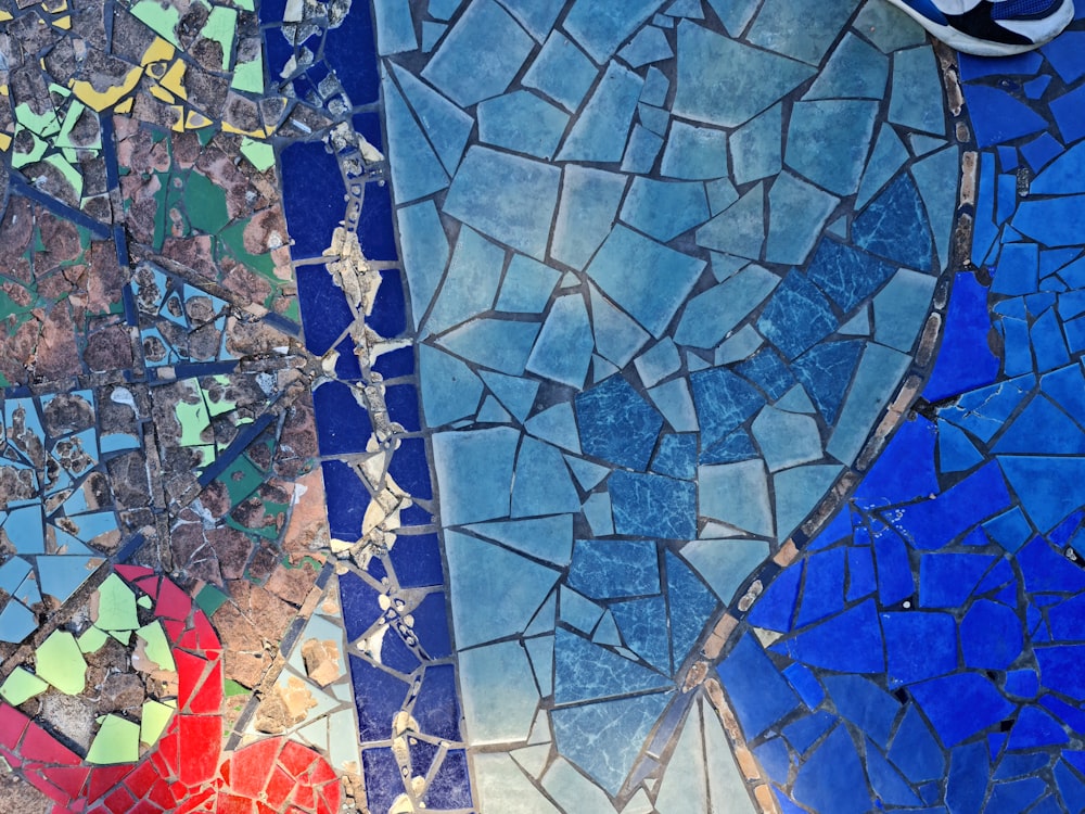 a close up of a mosaic tile wall