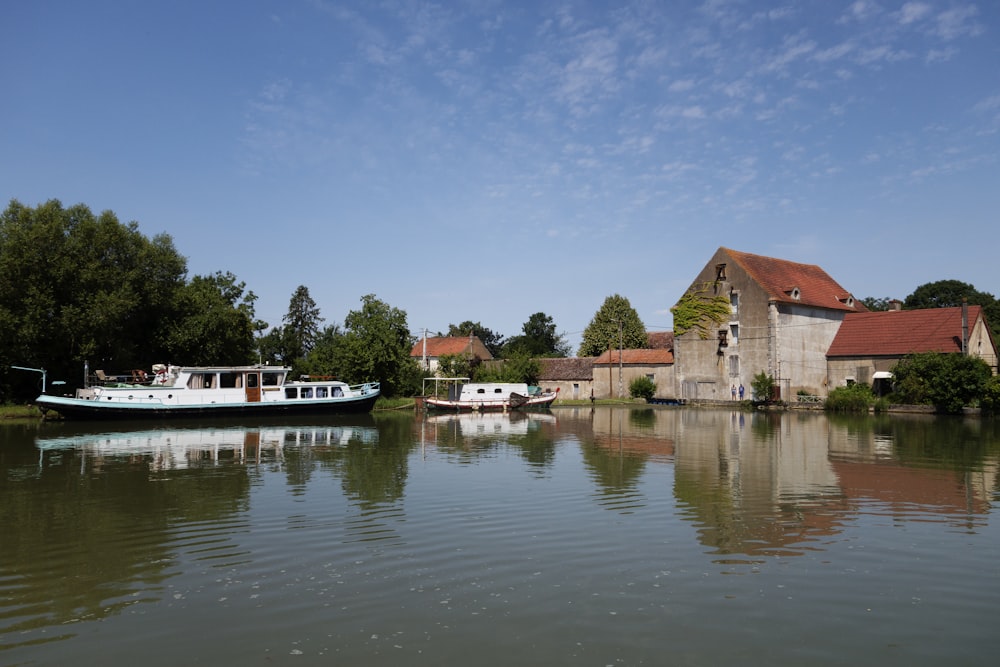 a boat on the water in front of a building