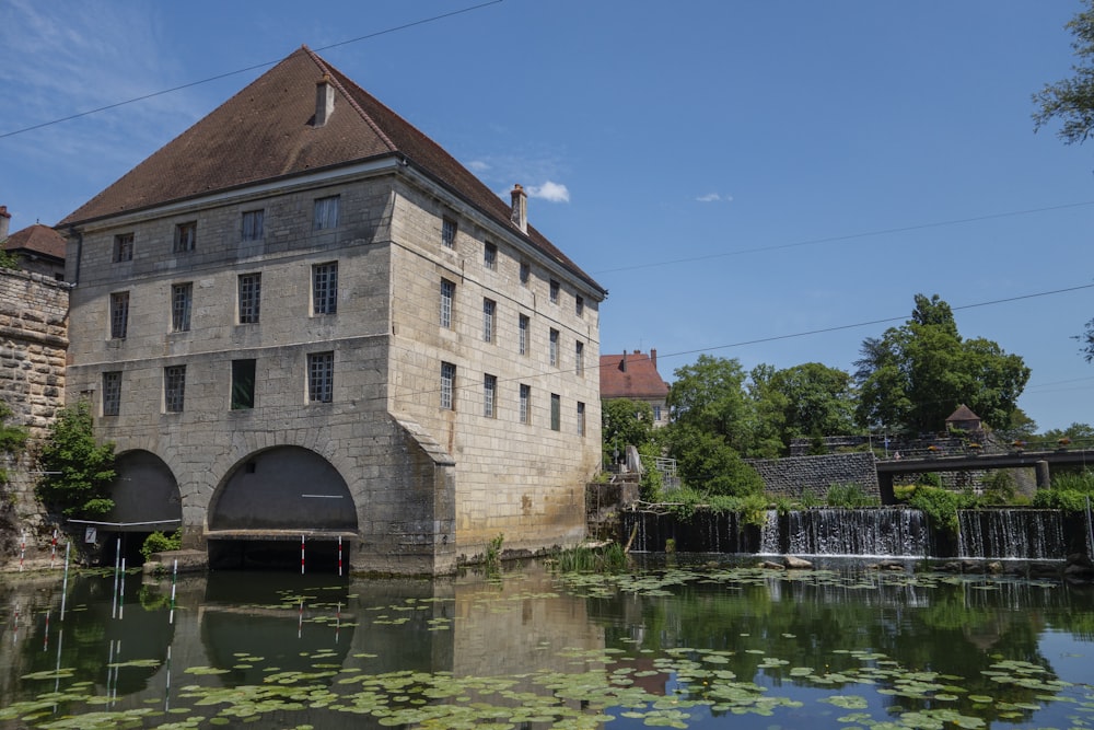 a large building sitting on top of a river