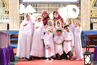 a group of young children standing next to each other