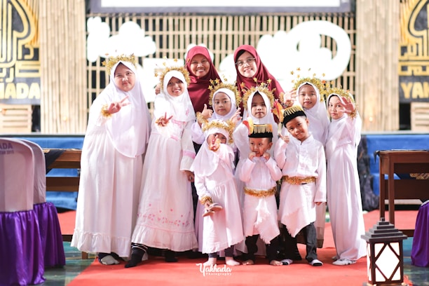 a group of young children standing next to each other