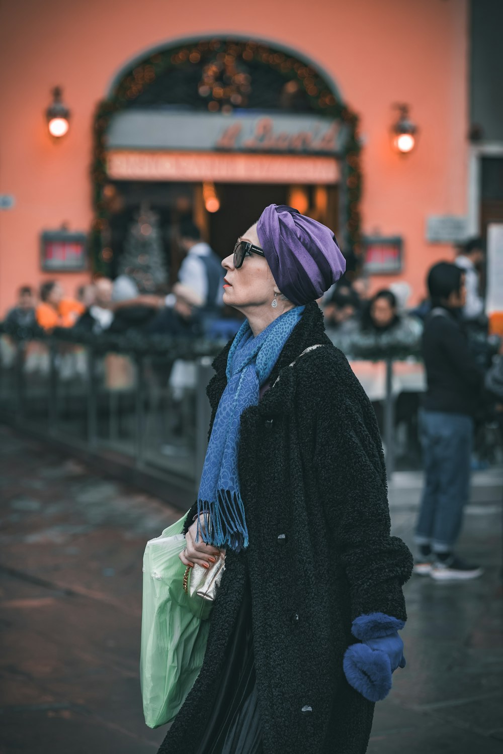 a woman with a purple hat and scarf